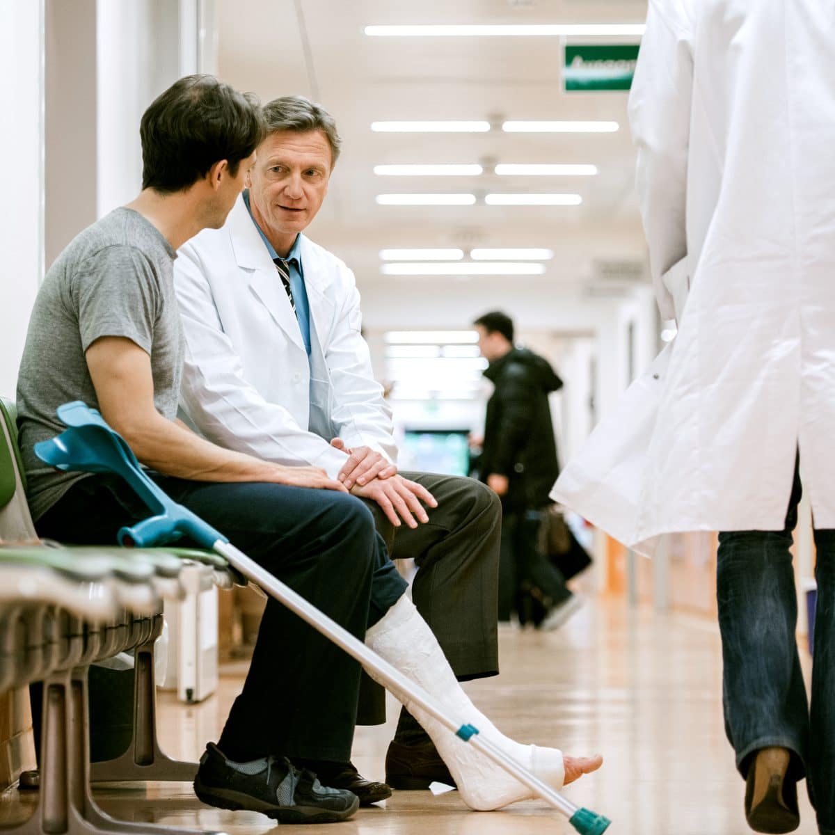 a man meeting with his doctor after an accident in Orange Beach, AL