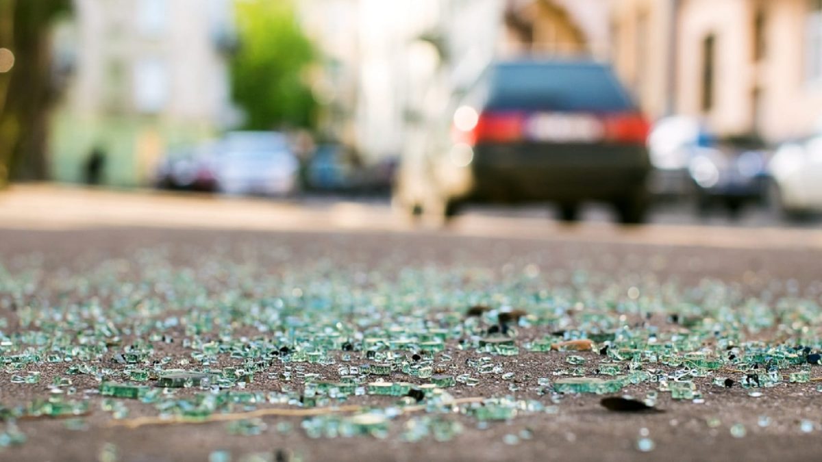 Broken Glass Scattered Across The Street Stock Photo