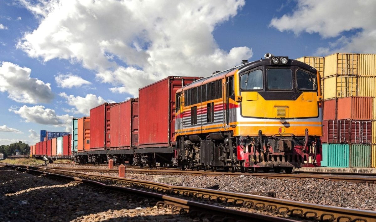 Cargo Train Traveling Down A Railroad Stock Photo