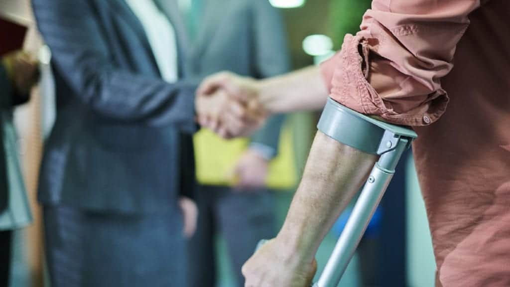 Injured Man On Crutches Stock Photo