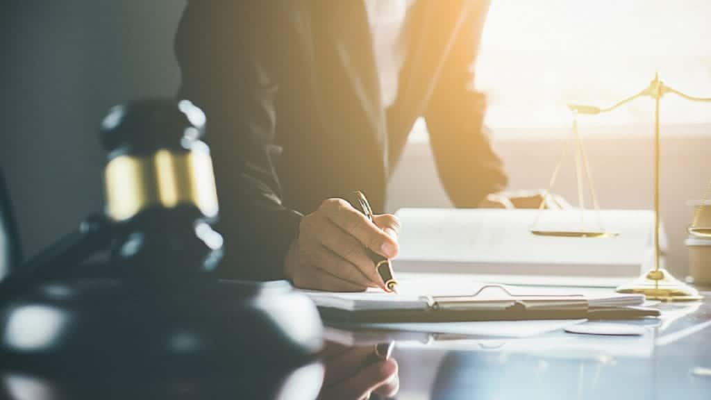 Lawyer Signing A Legal Document Stock Photo