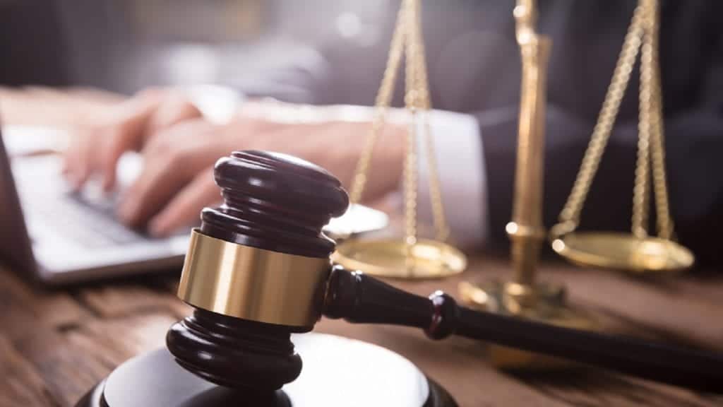 Lawyer Sitting At Desk Stock Photo