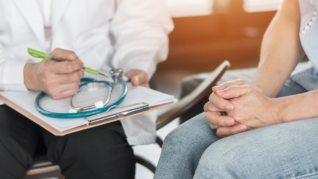 Medical Doctor Consulting A Patient Stock Photo