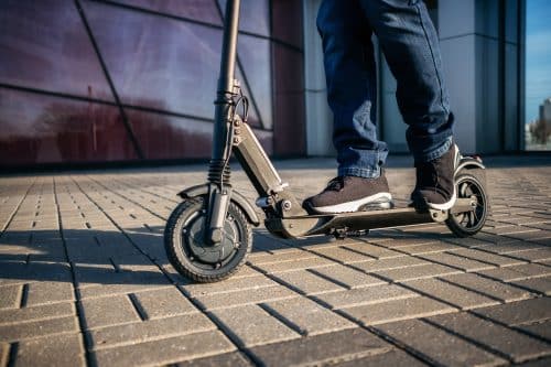 man riding an electric scooter