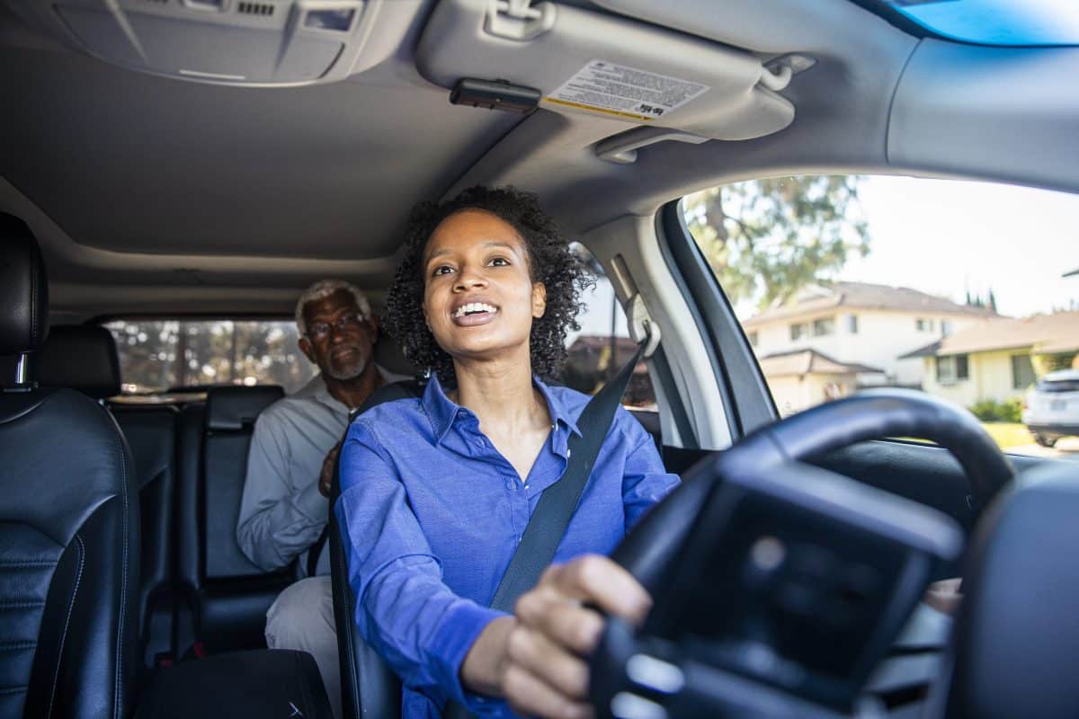 Young Black Woman Driving Car for Rideshare