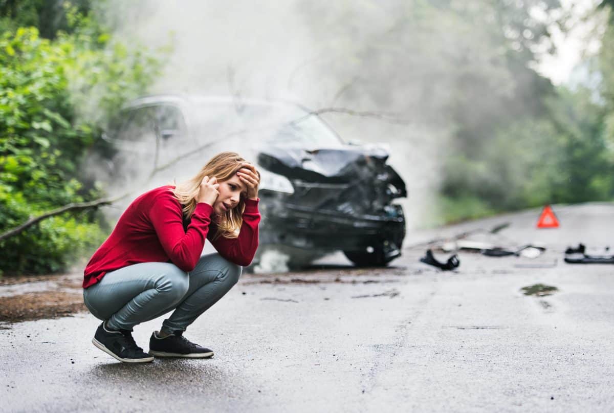 An Orange Beach, AL, woman calling her lawyer after getting into a car accident.