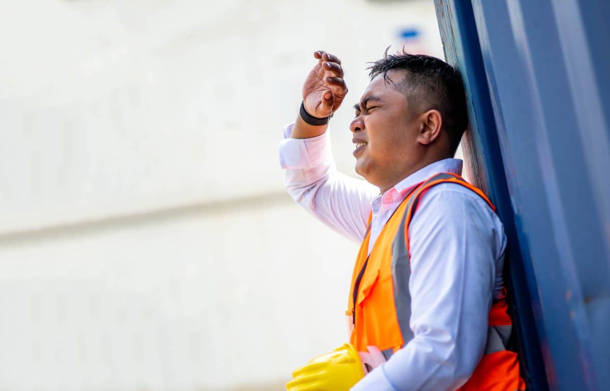 A construction worker feeling the effects of heat stroke