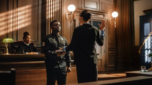 A woman swears in before testifying in court, promising that she will tell the truth in her testimony.